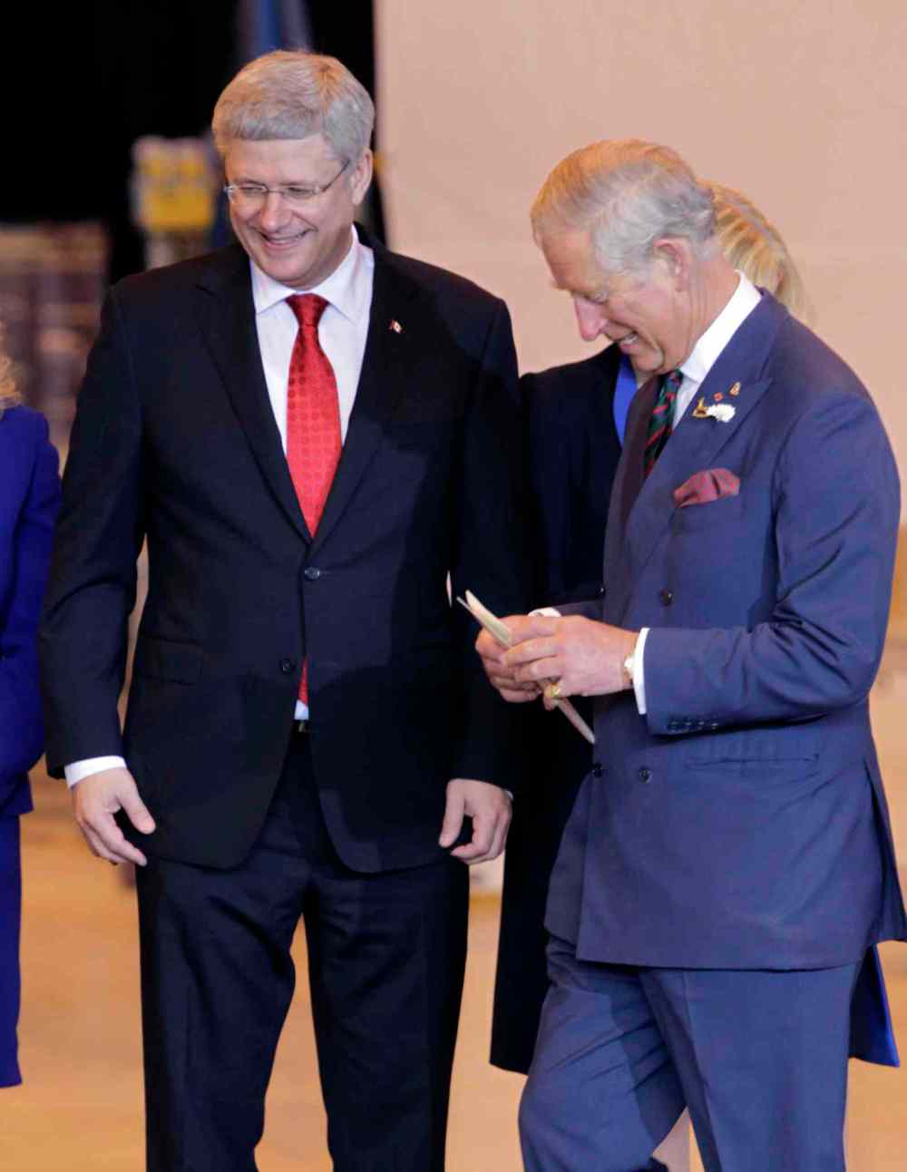 Wayne Glowacki / Winnipeg Free Press
At left, Prime Minister Stephen Harper invites Prince Charles to the podium at the ceremony in the Stevenson Hangar Wednesday morning.
