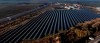 FILE -- A solar farm, front, and a biogas plant, rear, are seen in Oberkraemer, Germany, Thursday, Oct. 28, 2021. The German government presented a major package of reforms Wednesday to boost the construction of renewable power as part of its efforts to meet its climate goals and become independent of energy imports from hostile nations such as Russia. (AP Photo/Michael Sohn, file)