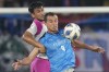 Kawasaki Frontale's Leandro Damiano Santos and Shahrul Mohd Saad of Johor Darul Ta'zim battle for the ball during the AFC Champions League soccer championship group I match at Sultan Ibrahim Stadium in Johor, Malaysia, Thursday April 21, 2022. (AP Photo/Vincent Thian)