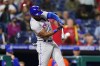 New York Mets' Starling Marte hits a run-scoring double against Philadelphia Phillies pitcher Corey Knebel during the ninth inning of a baseball game, Thursday, May 5, 2022, in Philadelphia. (AP Photo/Matt Slocum)