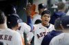 Houston Astros' Jeremy Pena, right, collects high-fives in the dugout after his home run against the Detroit Tigers during the fifth inning of a baseball game Thursday, May 5, 2022, in Houston. (AP Photo/Michael Wyke)