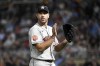 Houston Astros pitcher Justin Verlander reacts after Minnesota Twins' Gilberto Celestino was tagged while trying to steal second base keeping his no hitter alive during the sixth inning of a baseball game, Tuesday, May 10, 2022, in Minneapolis. (AP Photo/Craig Lassig)