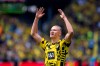 Dortmund's Erling Haaland cheers for the fans prior to the German Bundesliga soccer match between Borussia Dortmund and Hertha BSC Berlin in Dortmund, Germany, Saturday, May 14, 2022. (David Inderlied/dpa via AP)