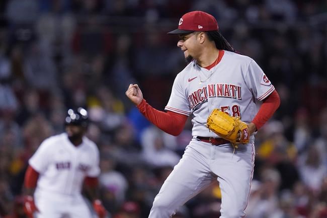 Cincinnati Reds starting pitcher Luis Castillo pumps his fist after striking out Boston Red Sox's J.D. Martinez to end the sixth inning of a baseball game Tuesday, May 31, 2022, at Fenway Park in Boston. (AP Photo/Charles Krupa)