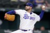 Texas Rangers starting pitcher Martin Perez throws to the Tampa Bay Rays in the first inning of a baseball game, Tuesday, May 31, 2022, in Arlington, Texas. (AP Photo/Tony Gutierrez)