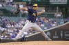 Milwaukee Brewers starting pitcher Eric Lauer delivers during the first inning of the team's baseball game against the Chicago Cubs on Tuesday, May 31, 2022, in Chicago. (AP Photo/Charles Rex Arbogast)