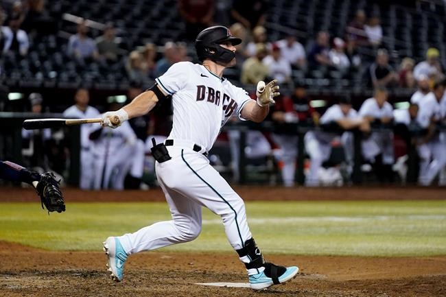 Arizona Diamondbacks' Cooper Hummel watches his double that drove in the winning run against the Atlanta Braves during the 10th inning of a baseball game Tuesday, May 31, 2022, in Phoenix. The Diamondbacks won 8-7. (AP Photo/Ross D. Franklin)