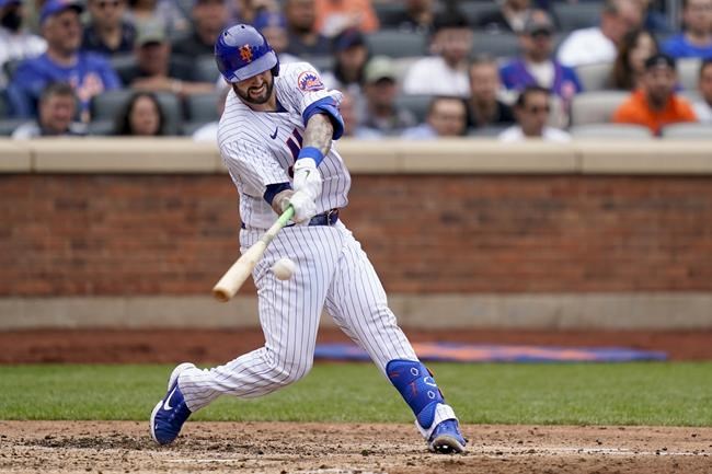 New York Mets' Tomas Nido hits a two-run double off Washington Nationals starting pitcher Evan Lee (59) in the fourth inning of a baseball game against the Washington Nationals, Wednesday, June 1, 2022, in New York. (AP Photo/John Minchillo)