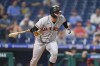 San Francisco Giants' Joc Pederson tosses his bat after hitting a run-scoring single during the 10th inning of a baseball game against the Philadelphia Phillies, Tuesday, May 31, 2022, in Philadelphia. (AP Photo/Matt Slocum)