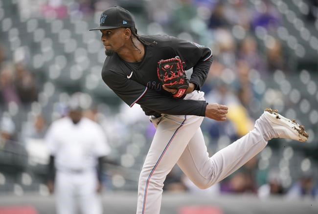 Miami Marlins starting pitcher Edward Cabrera works against the Colorado Rockies in the first inning of the first game of a baseball doubleheader, Wednesday, June 1, 2022, in Denver. (AP Photo/David Zalubowski)