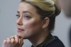 Actor Amber Heard listens in the courtroom in the Fairfax County Circuit Courthouse in Fairfax, Va., Wednesday, May 25, 2022. Actor Johnny Depp sued his ex-wife Amber Heard for libel in Fairfax County Circuit Court after she wrote an op-ed piece in The Washington Post in 2018 referring to herself as a 