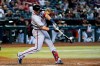 Atlanta Braves' Austin Riley connects for a three-run home run against the Arizona Diamondbacks during the seventh inning of a baseball game Wednesday, June 1, 2022, in Phoenix. (AP Photo/Ross D. Franklin)
