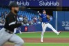 Toronto Blue Jays third baseball Matt Chapman (26), right, throws to first base to put out Chicago White Sox Leury Garcia, left, in the fourth inning of American League baseball action in Toronto on Wednesday, June 1, 2022. THE CANADIAN PRESS/Jon Blacker