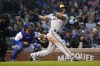 Milwaukee Brewers' Jace Peterson watches his RBI double off Chicago Cubs starting pitcher Kyle Hendricks during the fifth inning of a baseball game Wednesday, June 1, 2022, in Chicago. (AP Photo/Charles Rex Arbogast)