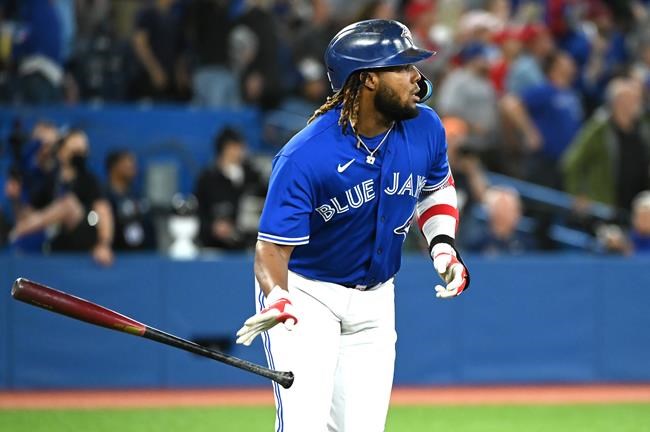 Toronto Blue Jays first baseman Vladimir Guerrero Jr watches his two run home run in the eighth inning against the Chicago White Sox during American League baseball action in Toronto on Wednesday, June 1, 2022. Bo Bichette also scored on the play. THE CANADIAN PRESS/Jon Blacker