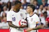 U.S. forward Christian Pulisic, right, hands the ball to Haji Wright (19) prior to a penalty kick during the second half of the team' international friendly soccer match against Morocco on Wednesday, June 1, 2022, in Cincinnati. (AP Photo/Jeff Dean)