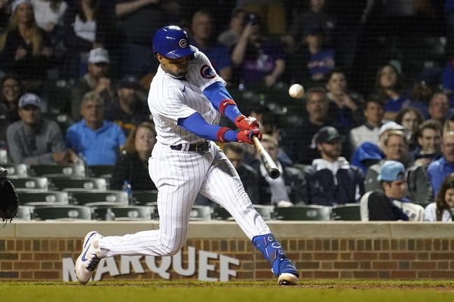 Chicago Cubs' Christopher Morel hits a sacrifice fly that scored Jason Heyward with the winning run during the 10th inning of the team's baseball game against the Milwaukee Brewers on Wednesday, June 1, 2022, in Chicago. (AP Photo/Charles Rex Arbogast)
