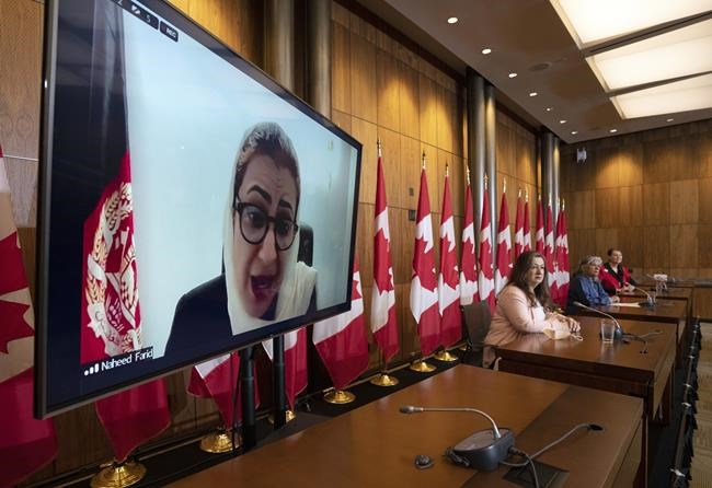 Afghan politician Naheed Farid speaks during a news conference as Senator Salma Ataullahjan, Senator Ratna Omidvar and Senator Marilou McPhedran look on during a news conference about Afghanistan, Thursday, June 2, 2022 in Ottawa. THE CANADIAN PRESS/Adrian Wyld