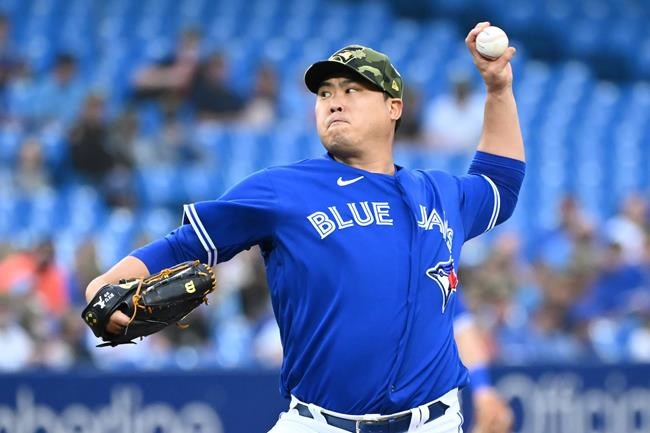 Toronto Blue Jays' Hyun Jin Ryu pitches in the first inning of an Interleague League baseball game against the Cincinnati Reds in Toronto, Friday, May 20, 2022.The Blue Jays placed left-hander Hyun Jin Ryu on the 15-day injured list Thursday due to left forearm inflammation. THE CANADIAN PRESS/Jon Blacker
