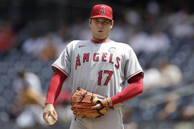 Los Angeles Angels pitcher Shohei Ohtani reacts during the third inning of the first baseball game of a doubleheader against the New York Yankees on Thursday, June 2, 2022, in New York. (AP Photo/Adam Hunger)