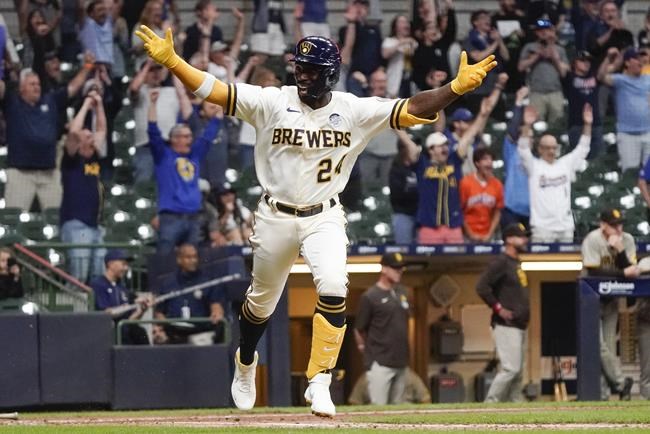 Milwaukee Brewers' Andrew McCutchen celebrates after hitting a walk-off RBI single during the ninth inning of a baseball game against the San Diego Padres Thursday, June 2, 2022, in Milwaukee. The Brewers won 5-4. (AP Photo/Morry Gash)