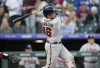 Atlanta Braves' Travis d'Arnaud follows the flight of his grand slam off Colorado Rockies starting pitcher Austin Gomber in the fifth inning of a baseball game Thursday, June 2, 2022, in Denver. (AP Photo/David Zalubowski)