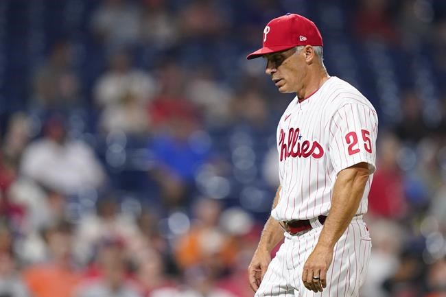 FILE - Philadelphia Phillies' Joe Girardi walks to the dugout during a baseball game, Tuesday, May 31, 2022, in Philadelphia. Joe Girardi was fired by the Philadelphia Phillies on Friday, June 3, 2022, after his team's terrible start, becoming the first major league manager to lose his job this season. Philadelphia said bench coach Rob Thomson will become interim manager for the rest of the season. (AP Photo/Matt Slocum, File)