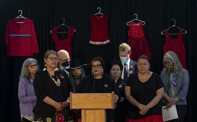 Justice Minister David Lametti, Crown-Indigenous Relations Minister Marc Miller and Indigenous Services Minister Patty Hajdu and other women listen to Hilda Anderson-Pyrz, chairwoman of the National Family and Survivors Circle, speak during an event in Gatineau, Que., on Friday marking the first anniversary of a national plan to end violence against Indigenous Women and Girls. THE CANADIAN PRESS/Adrian Wyld