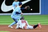 Minnesota Twins' centre fielder Byron Buxton (25) slides safely into second base ahead of the tag by Toronto Blue Jays' second baseman Cavan Biggio (8) for a double in the fifth inning of American League baseball action in Toronto on Friday, June 3, 2022. THE CANADIAN PRESS/Jon Blacker