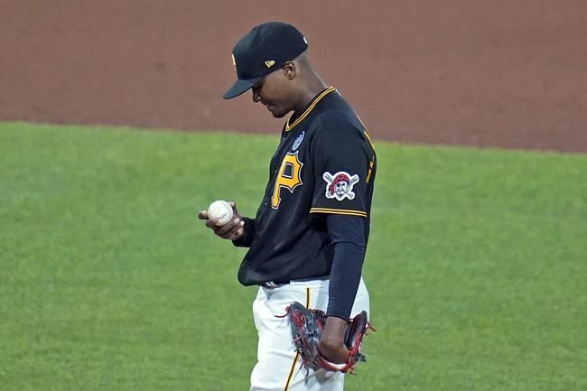 Pittsburgh Pirates relief pitcher Yerry De Los Santos collects himself after giving up back-to-back solo home runs to Arizona Diamondbacks' Jake McCarthy and Alek Thomas during the seventh inning of a baseball game in Pittsburgh, Friday, June 3, 2022. (AP Photo/Gene J. Puskar)