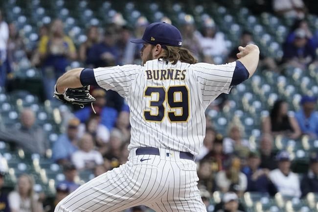 Milwaukee Brewers starting pitcher Corbin Burnes throws during the first inning of a baseball game against the San Diego Padres Friday, June 3, 2022, in Milwaukee. (AP Photo/Morry Gash)