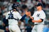 New York Yankees relief pitcher Manny Banuelos, right, celebrates with catcher Jose Trevino after the team's 13-0 win in a baseball game against the Detroit Tigers on Friday, June 3, 2022, in New York. (AP Photo/Frank Franklin II)