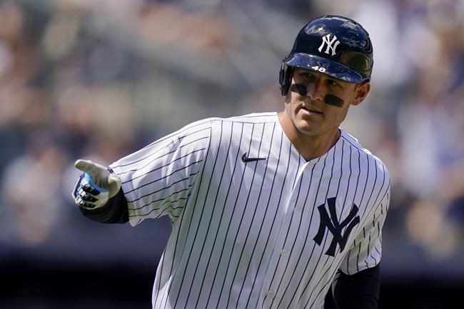 New York Yankees' Anthony Rizzo points to the dugout after hitting a solo home run off Detroit Tigers starting pitcher Beau Brieske (63) in the sixth inning of a baseball game, Saturday, June 4, 2022, in New York. (AP Photo/John Minchillo)