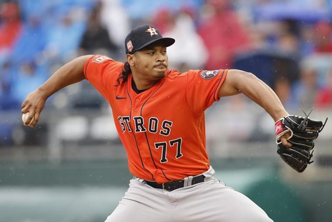 Houston Astros pitcher Luis Garcia delivers to a Kansas City Royals batter during the first inning of a baseball game in Kansas City, Mo., Saturday, June 4, 2022. (AP Photo/Colin E. Braley)