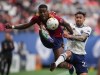 Real Salt Lake's Sergio Cordova, left, and Vancouver Whitecaps' Erik Godoy vie for the ball during the first half of an MLS soccer game in Vancouver, on Saturday, June 4, 2022. THE CANADIAN PRESS/Darryl Dyck