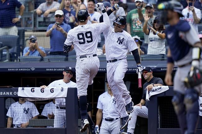 New York Yankees' Aaron Judge (99) celebrates with Anthony Rizzo (48) after hitting a solo home run off Detroit Tigers starting pitcher Beau Brieske (63) in the first inning of a baseball game, Saturday, June 4, 2022, in New York. (AP Photo/John Minchillo)