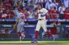 Philadelphia Phillies' Bryson Stott celebrates after hitting a winning three-run home run off Los Angeles Angels' Jimmy Herget (46) during the ninth inning of a baseball game, Sunday, June 5, 2022, in Philadelphia. (AP Photo/Derik Hamilton)