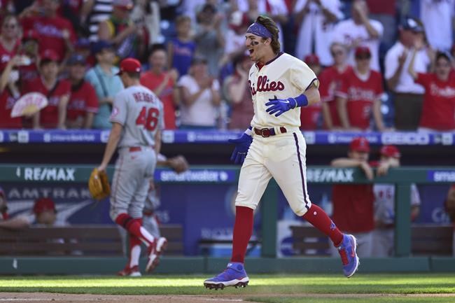 Philadelphia Phillies' Bryson Stott celebrates after hitting a winning three-run home run off Los Angeles Angels' Jimmy Herget (46) during the ninth inning of a baseball game, Sunday, June 5, 2022, in Philadelphia. (AP Photo/Derik Hamilton)