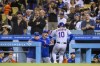 New York Mets' Eduardo Escobar, right, celebrates with manager Buck Showalter, left, after Escobar hit a solo home run against the Los Angeles Dodgers during the fourth inning of a baseball game in Los Angeles, Saturday, June 4, 2022. (AP Photo/Alex Gallardo)
