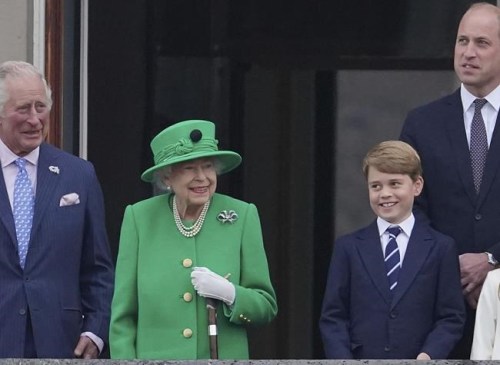 From left, Prince Charles, Queen Elizabeth II, Prince George and Prince William appear on the balcony of Buckingham Palace during the Platinum Jubilee Pageant outside Buckingham Palace in London, Sunday June 5, 2022.  After four days of parades, street parties and a gala concert celebrating Queen Elizabeth II's 70 years on the throne, the Platinum Jubilee ended Sunday with the crowd outside Buckingham Palace singing 