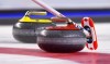 Curling Canada high-performance director Gerry Peckham will begin a new role with the organization next season as he starts the transition to retirement. Team Canada broom marks a stone during the Scotties Tournament of Hearts in St. Catharines, Ont., on Saturday, Feb. 18, 2017. THE CANADIAN PRESS/Sean Kilpatrick