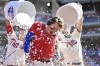 Philadelphia Phillies' Bryson Stott is doused by teammates after hitting a walkoff three-run home run during the ninth inning of a baseball game off Los Angeles Angels' Jimmy Herget, Sunday, June 5, 2022, in Philadelphia. (AP Photo/Derik Hamilton)