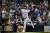 New York Mets' Eduardo Escobar reacts after hitting a two-run home run during the eighth inning of a baseball game against the San Diego Padres, Monday, June 6, 2022, in San Diego. (AP Photo/Gregory Bull)