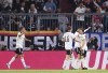 Germany's Jonas Hofmann, right, celebrates with teammates after scoring his side's opening goal during the UEFA Nations League soccer match between Germany and England at the Allianz Arena, in Munich, Germany, Tuesday, June 7, 2022. (AP Photo/Markus Ulmer)