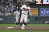 Minnesota Twins' Byron Buxton reacts on his way to home base after hitting a home run during the fifth inning of the team's baseball game against the New York Yankees, Wednesday, June 8, 2022, in Minneapolis. (AP Photo/Stacy Bengs)