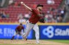 Arizona Diamondbacks' Merrill Kelly throws during the first inning of the team's baseball game against the Cincinnati Reds in Cincinnati, Wednesday, June 8, 2022. (AP Photo/Aaron Doster)