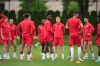 Canadian national men's soccer team forward Alphonso Davies, centre, stands with his teammates during a training session for a CONCACAF Nations League match against Curacao in Vancouver on Tuesday, June 7, 2022.&nbsp;After a drama-filled week away from the field, Canada's men's soccer team will finally take the field in front of hometown fans again tonight. THE CANADIAN PRESS/Darryl Dyck