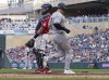 New York Yankees' Joey Gallo, right, scores past Minnesota Twins catcher Gary Sánchez on an Aaron Judge RBI single in the fourth inning of a baseball game, Tuesday, June 7, 2022, in Minneapolis. (AP Photo/Jim Mone)