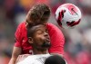 Curacao's Rangelo Janga, front, and Canada's Alistair Johnston vie for the ball during the first half of a CONCACAF Nations League soccer match, in Vancouver, on Thursday, June 9, 2022. THE CANADIAN PRESS/Darryl Dyck
