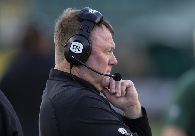 Edmonton Elks head coach Chris Jones on the field against the Calgary Stampeders during first half CFL pre season action in Edmonton, Friday, June 3, 2022. Jones inherits an Edmonton team that went 3-11 last year, and didn’t win a single game at home — the first time that’s happened in Elks history. THE CANADIAN PRESS/Jason Franson